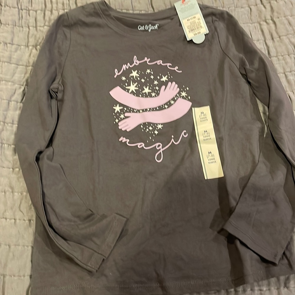 Brand new cat and jack girls t shirt size 7-8. It is gray with purple writing.